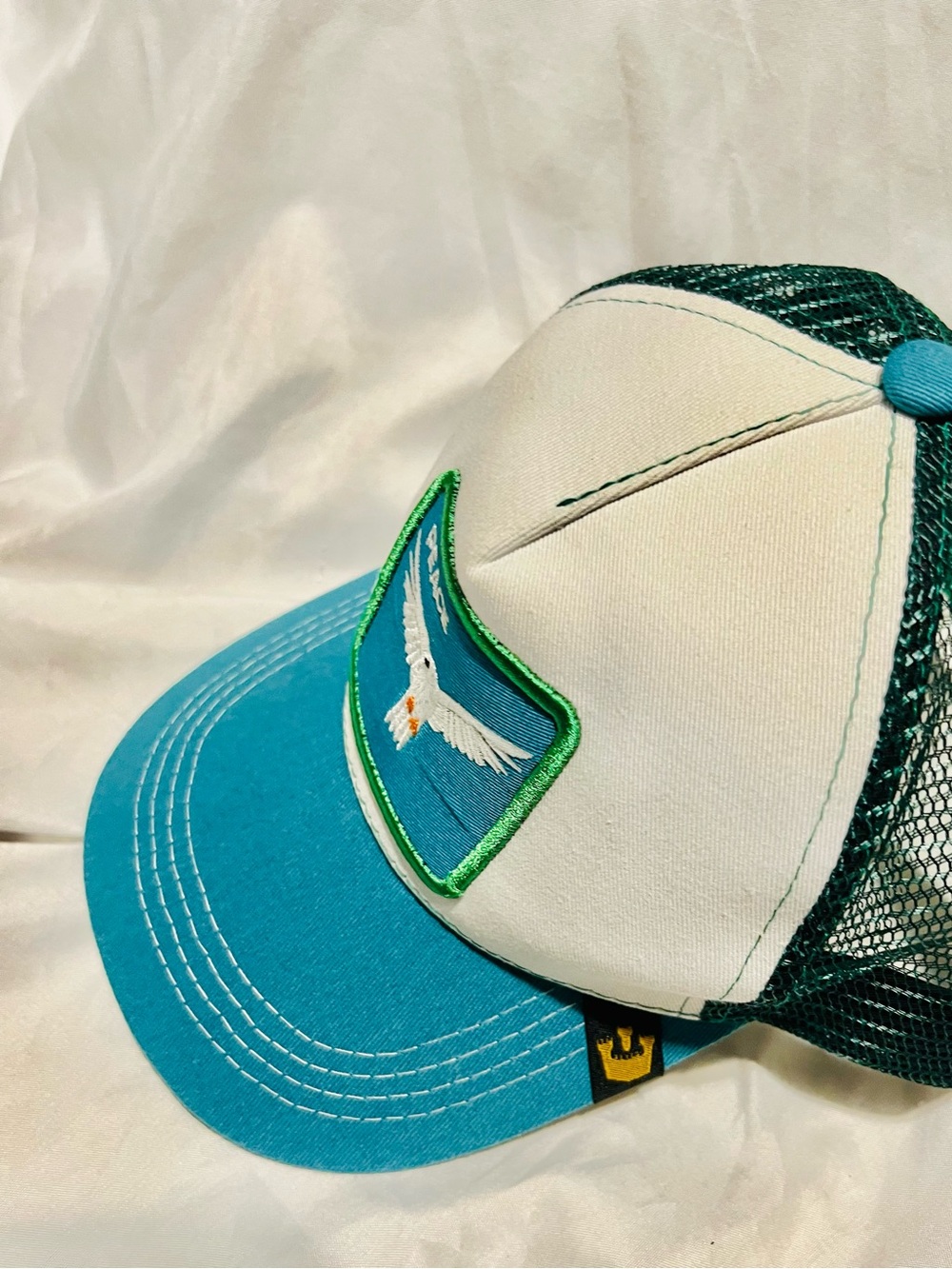 Peace Dove Trucker Hat in Teal and White - Picture 3 of 4